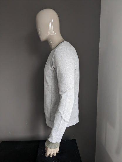 SilverCreek-Pullover mit Daumenlöchern. Graugrün gestreift. Größe M.