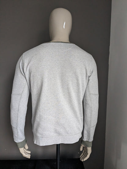 SilverCreek-Pullover mit Daumenlöchern. Graugrün gestreift. Größe M.