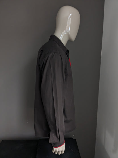 Chemise Olivier Strelli. De couleur marron foncé. Taille XL.