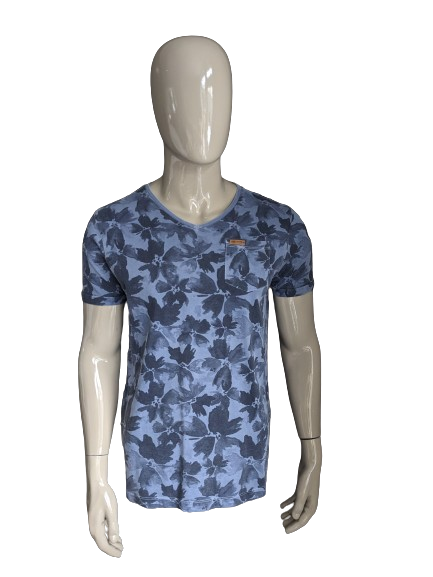 Camisa de leyenda de PME con cuello en V. Flores azules impresas. Talla L.