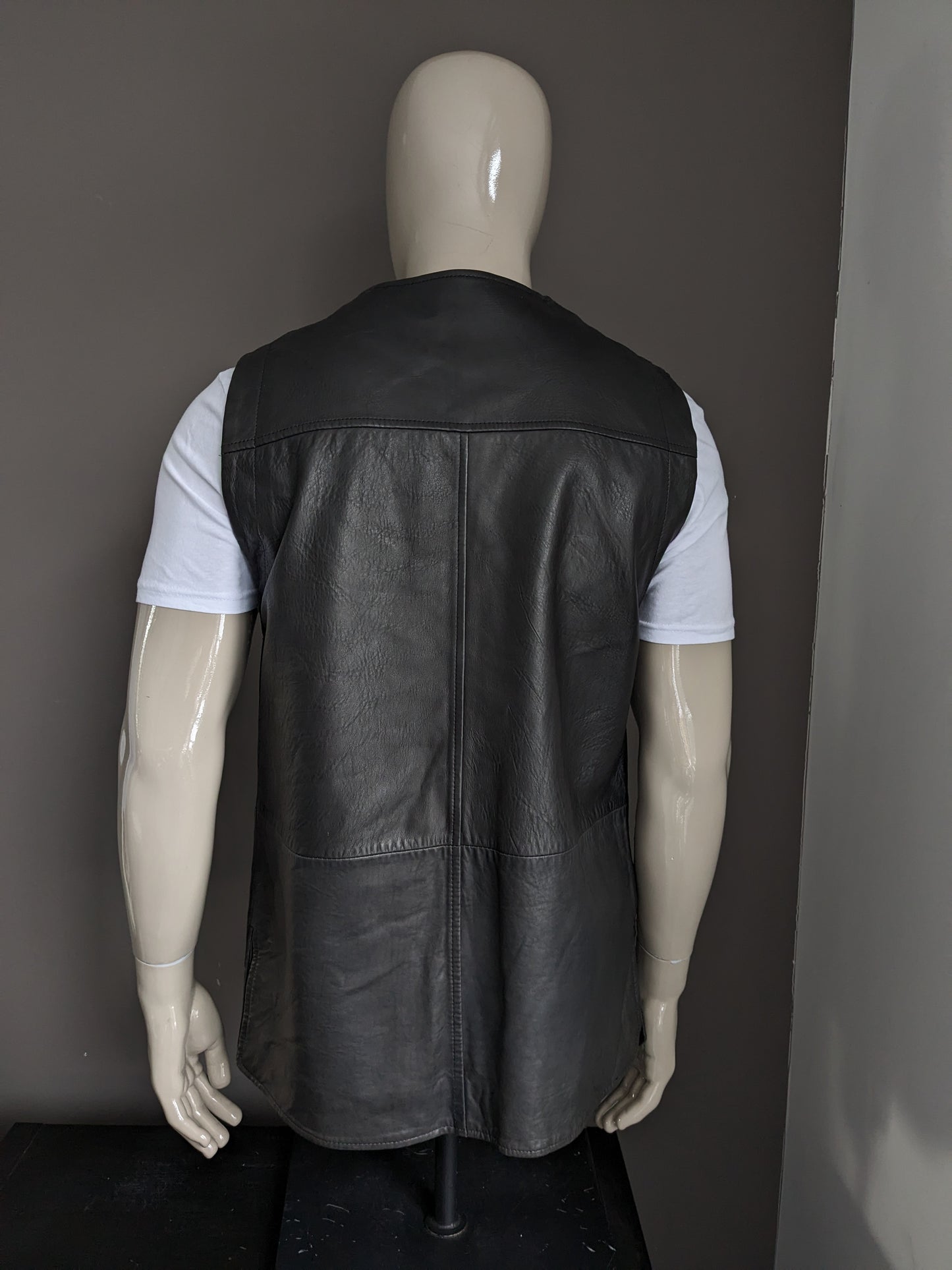 Mid-length double-sided leather waistcoat with beautiful buttons. Dark brown. Size L.