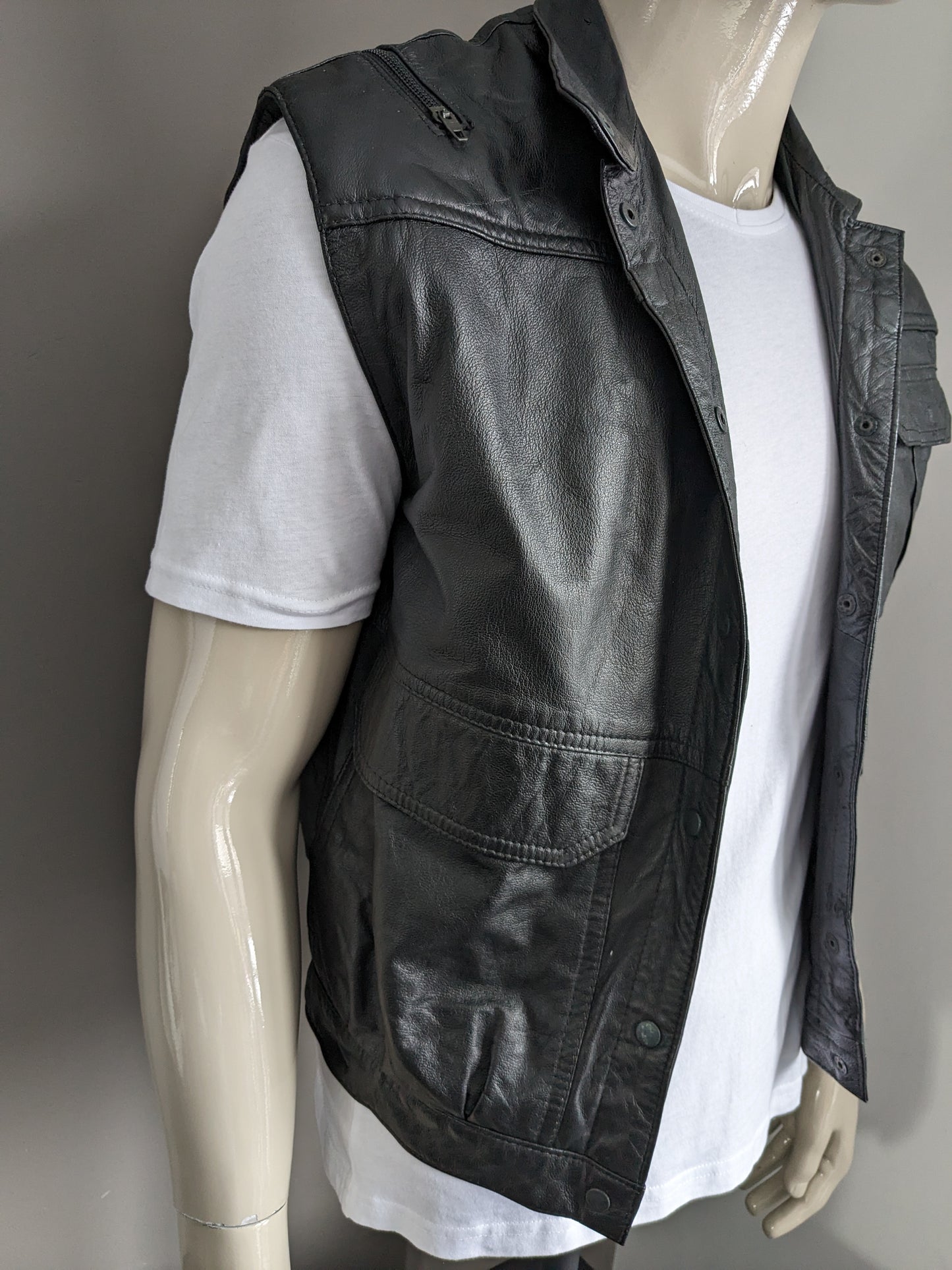Vintage 80's C&A leather body warmer / waistcoat with bags, zipper applications and press studs. Black. Size M.