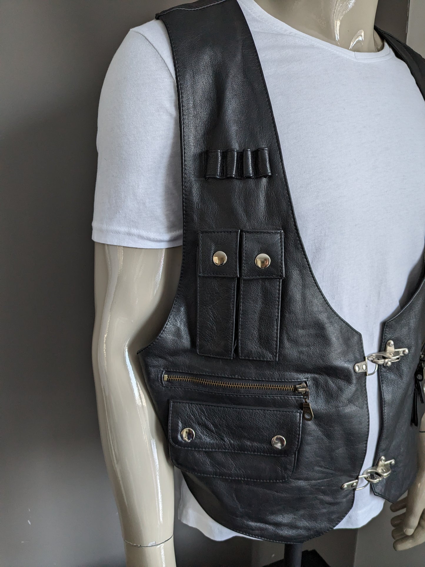 Vintage mom fashion double -sided leather waistcoat with lots of bags and buckles. Black. Size XL.
