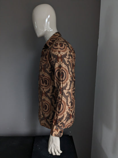 Batik Warda shirt. Lightly lined. Black Brown print. Size M.