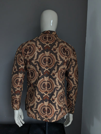 Batik Warda shirt. Lightly lined. Black Brown print. Size M.
