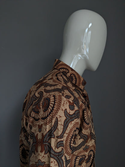 Batik Warda shirt. Lightly lined. Black Brown print. Size M.