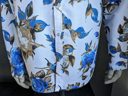 Chemise imprimée sans marque. Imprimé floral bleu marron. Taille XL.