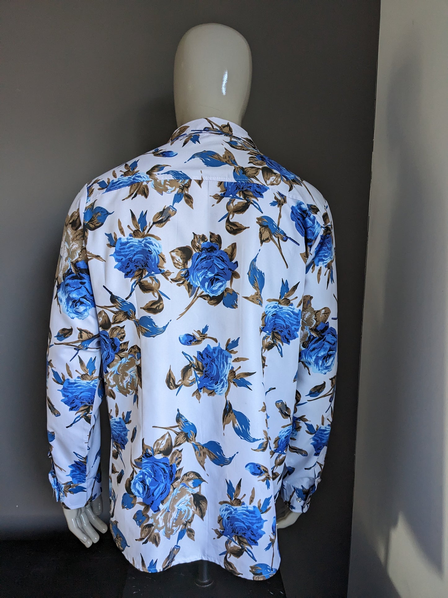 Chemise imprimée sans marque. Imprimé floral bleu marron. Taille XL.