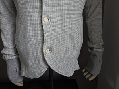 Cardigan Diesel avec col et boutons. Gris mélangé avec trous pour les pouces dans la manche. Taille L.
