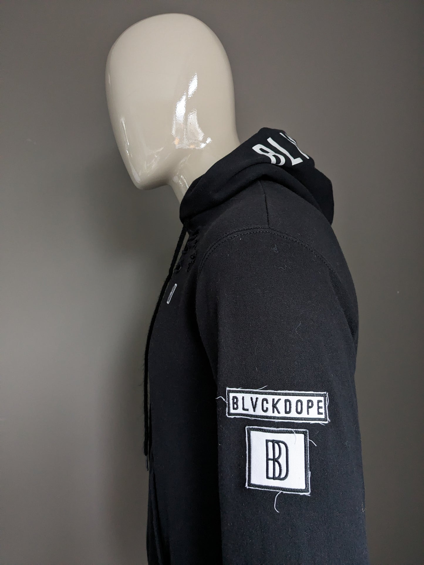 Blvckdope hoodie. Black with decorative holes and applications. Size S.