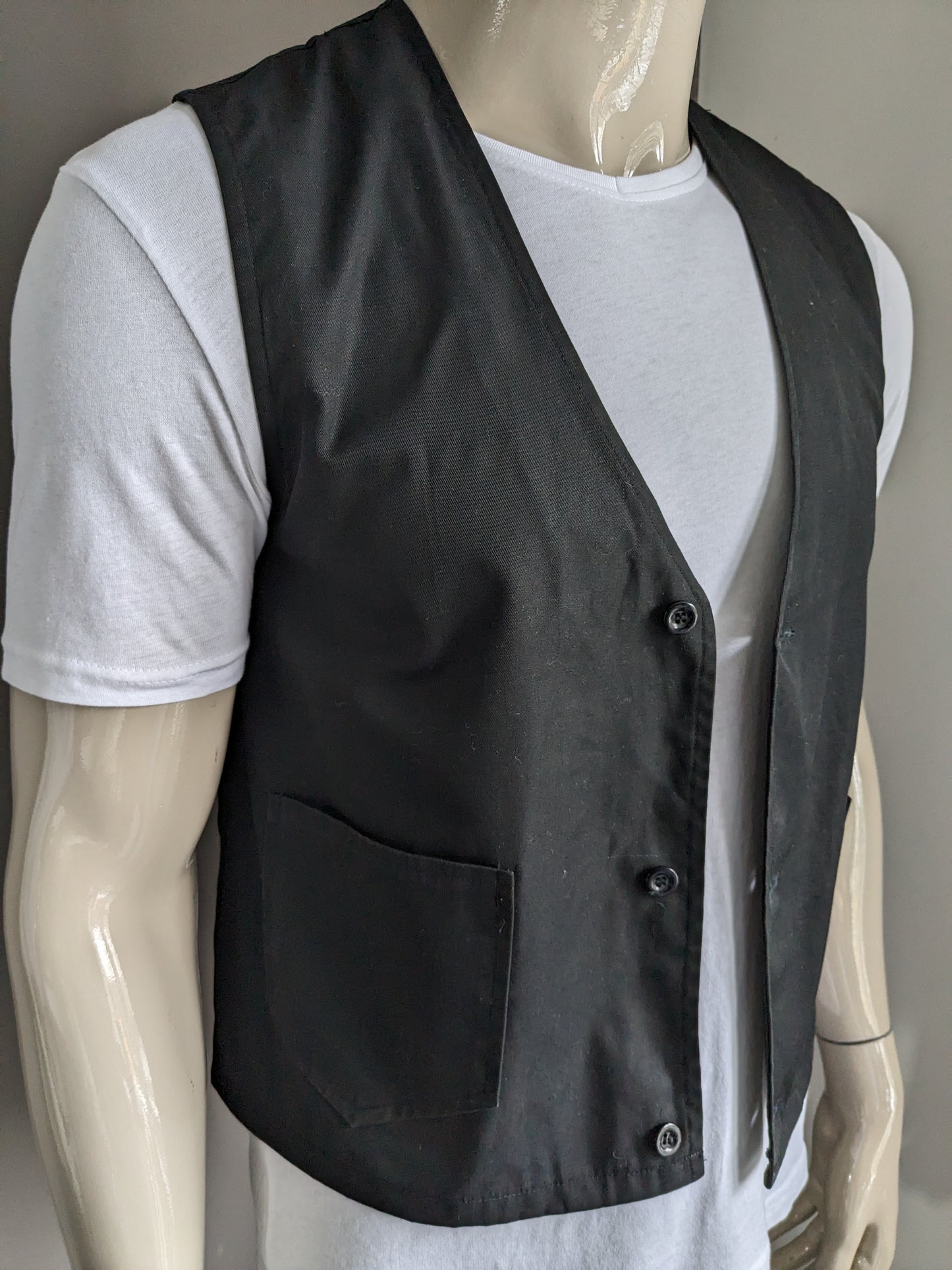 Gilet with bags. Black colored. Size M. #333.