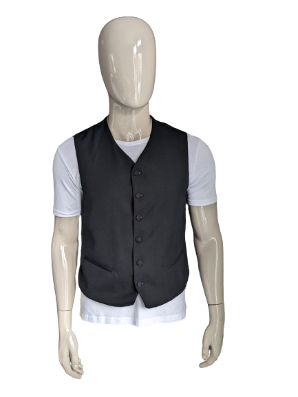 Gilet met gestoffeerde knoopjes. Zwart gekleurd. Maat M. #337.