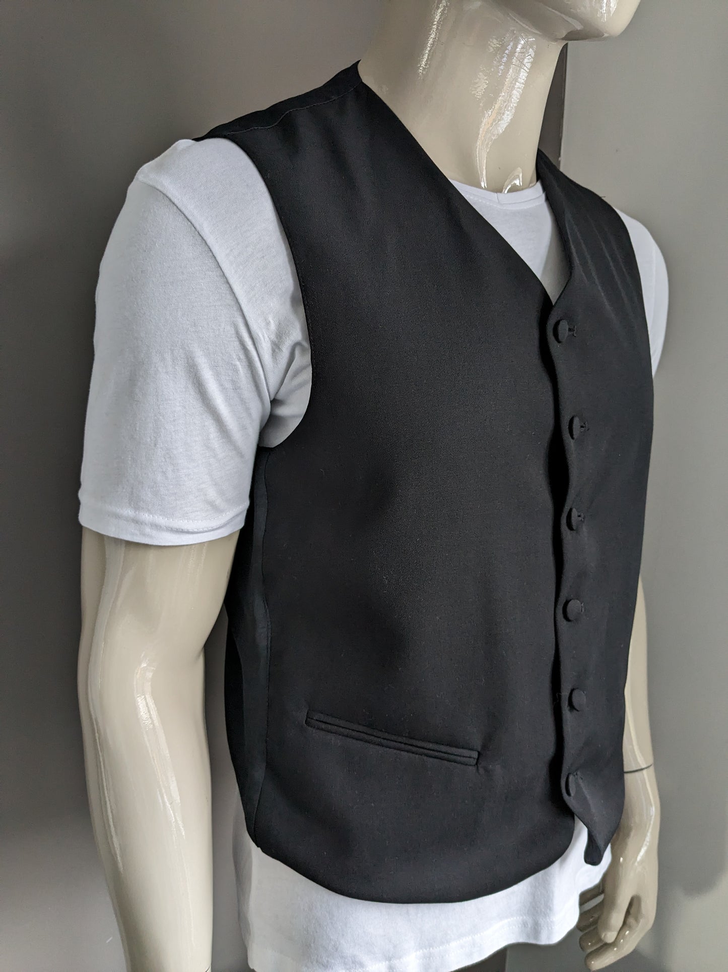Gilet with upholstered buttons. Black colored. Size M. #337.