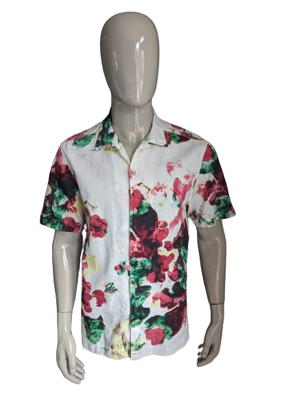 Kurzärmliges Hemd mit Logg-Print von H&M. Beige-rot-gelb-grüner Blumendruck. Größe L. Normale Passform.
