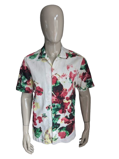 Kurzärmliges Hemd mit Logg-Print von H&M. Beige-rot-gelb-grüner Blumendruck. Größe L. Normale Passform.