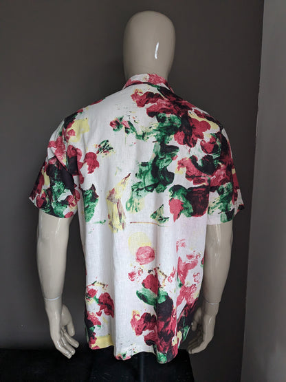 Kurzärmliges Hemd mit Logg-Print von H&M. Beige-rot-gelb-grüner Blumendruck. Größe L. Normale Passform.