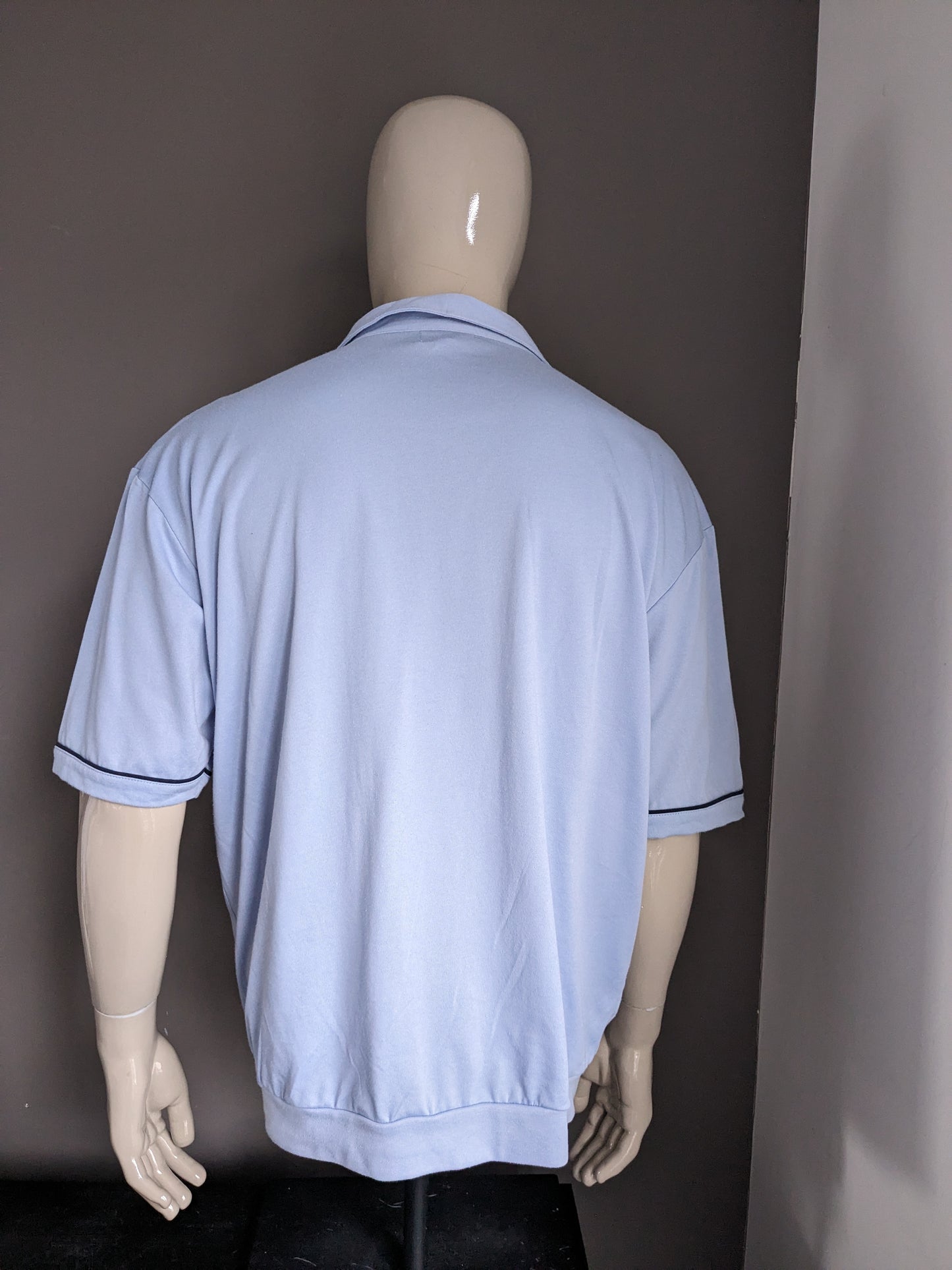 Vintage Roger has Polo with elastic band. Blue. Size XXL.