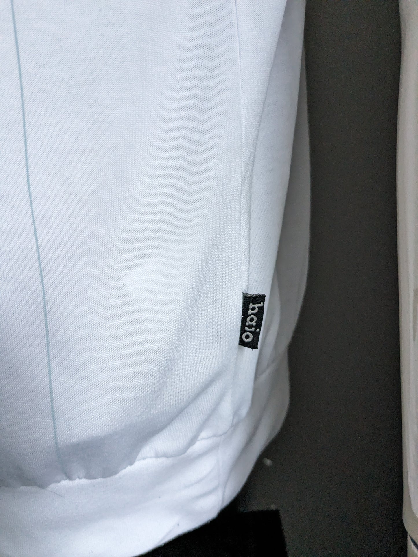 Polo Hajo vintage con fascia elastica. Bianco con stampa. Taglia L / XL.
