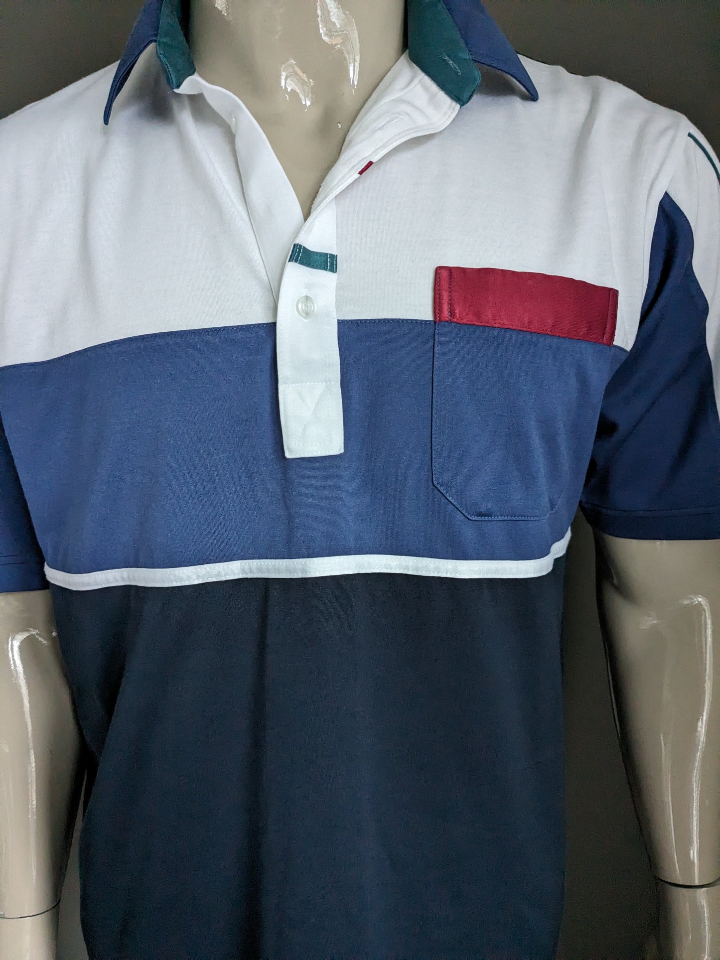 St. Michael Polo. Blue red green colored. Size XL.