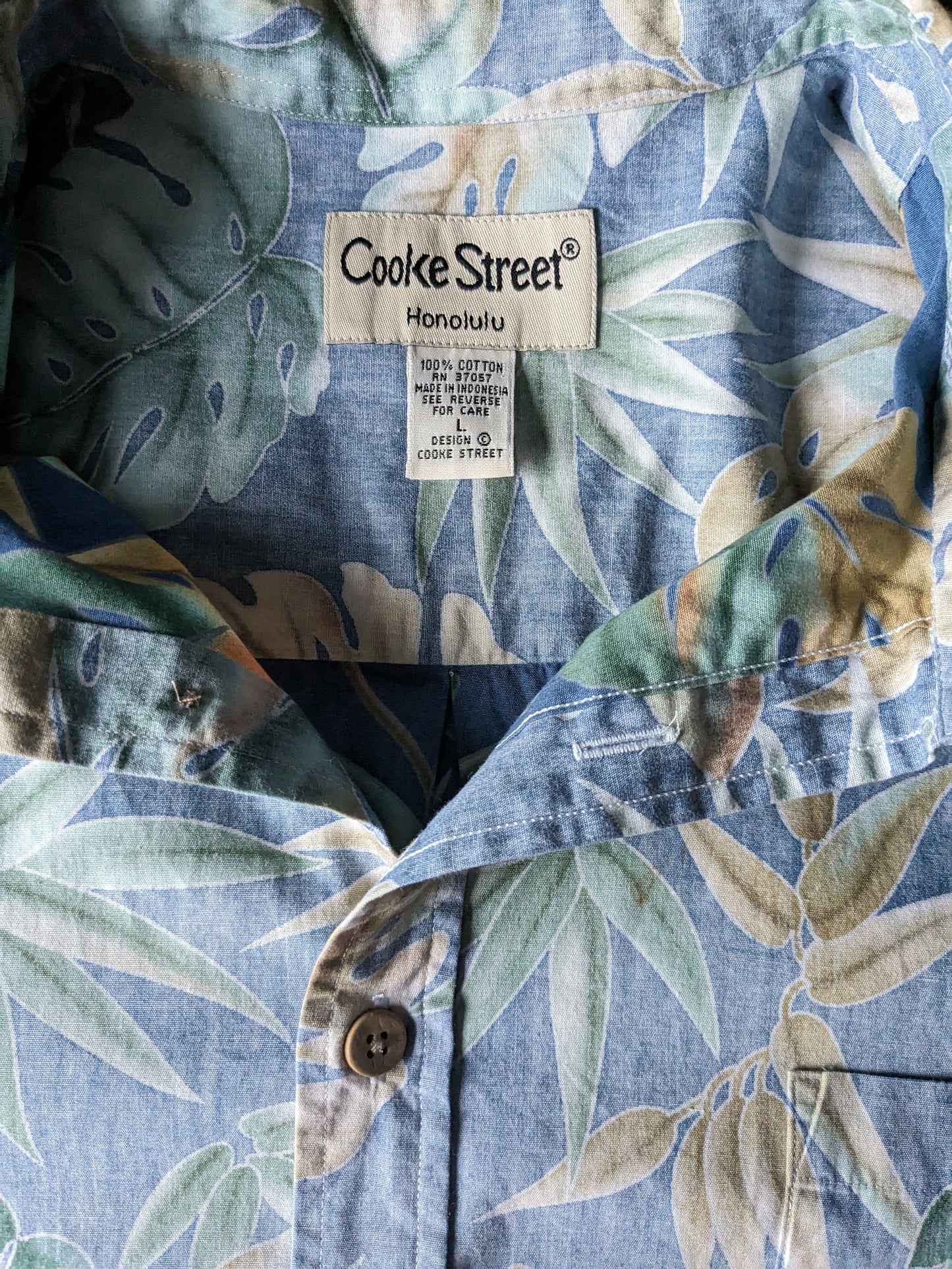 Cook Street Honolulu Original Hawaii Shirt Kurzarm. Blaues beige grünes Blattmotiv. Größe L / XL.