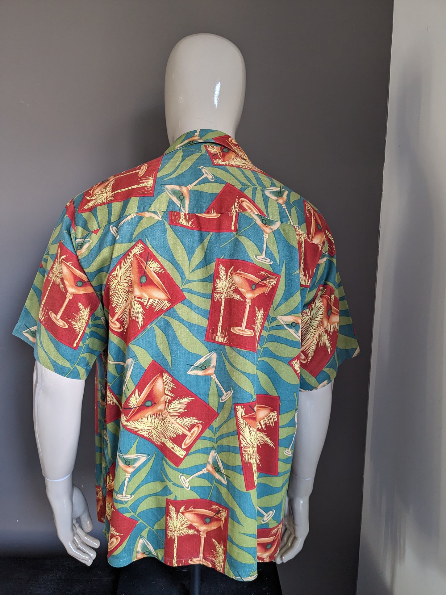 Banana Cabana Original Hawaii Camiseta Camiseta corta. Estampado azul rojo verde. Tamaño L / XL.