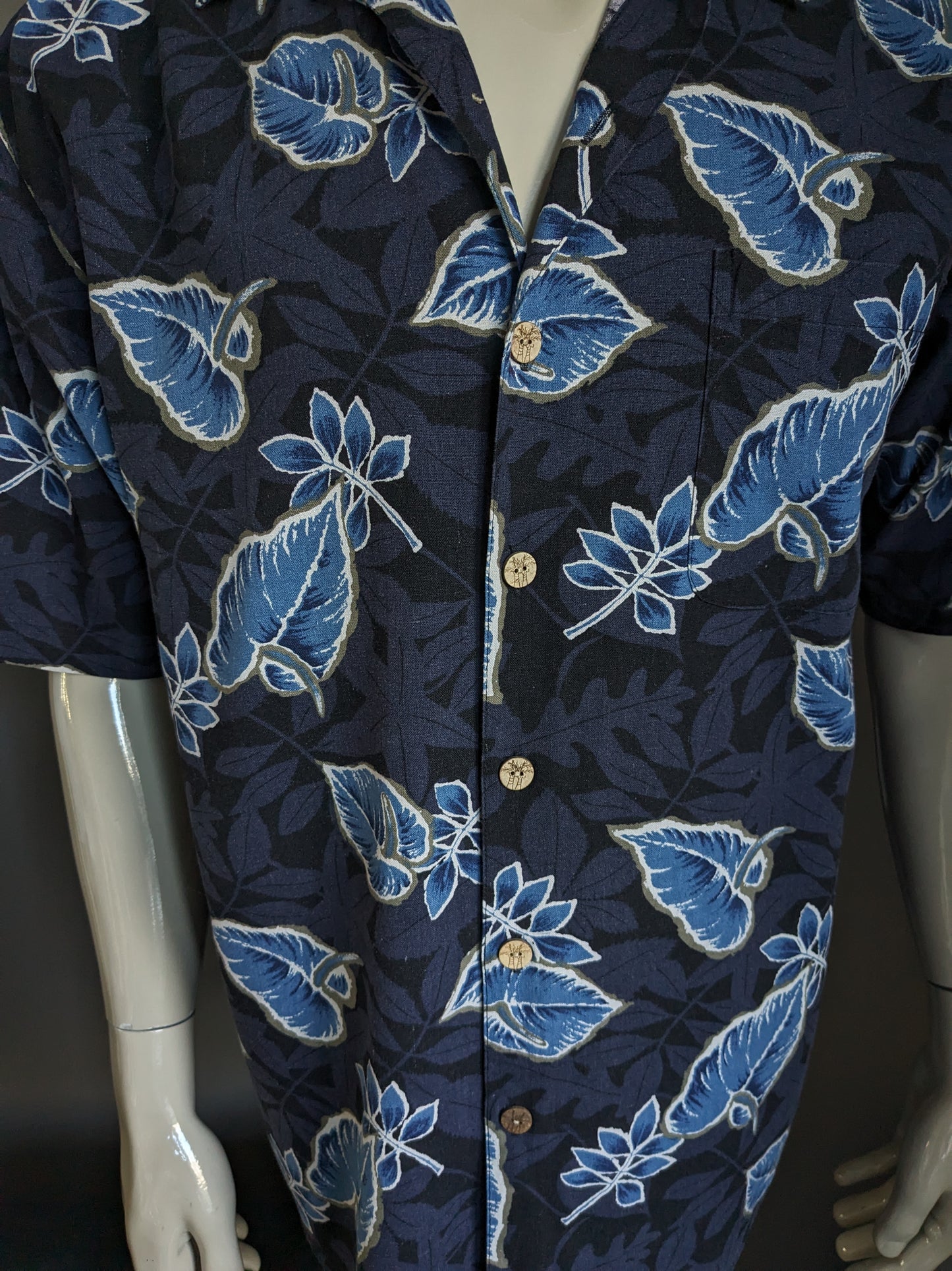 Paradise Blue Silk Hawaii Camisa Manga corta. Motivo de hoja azul. Tamaño xl. 70% de seda.