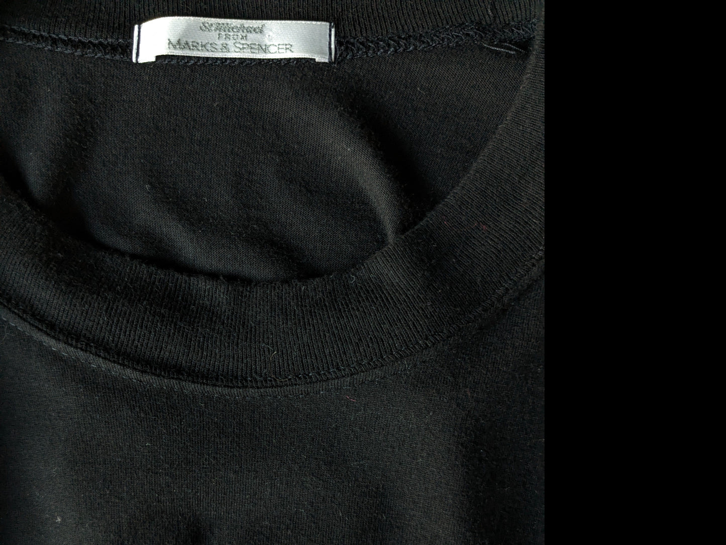 Marks & Spencer -Shirt. Schwarz mit Druck. Größe L.
