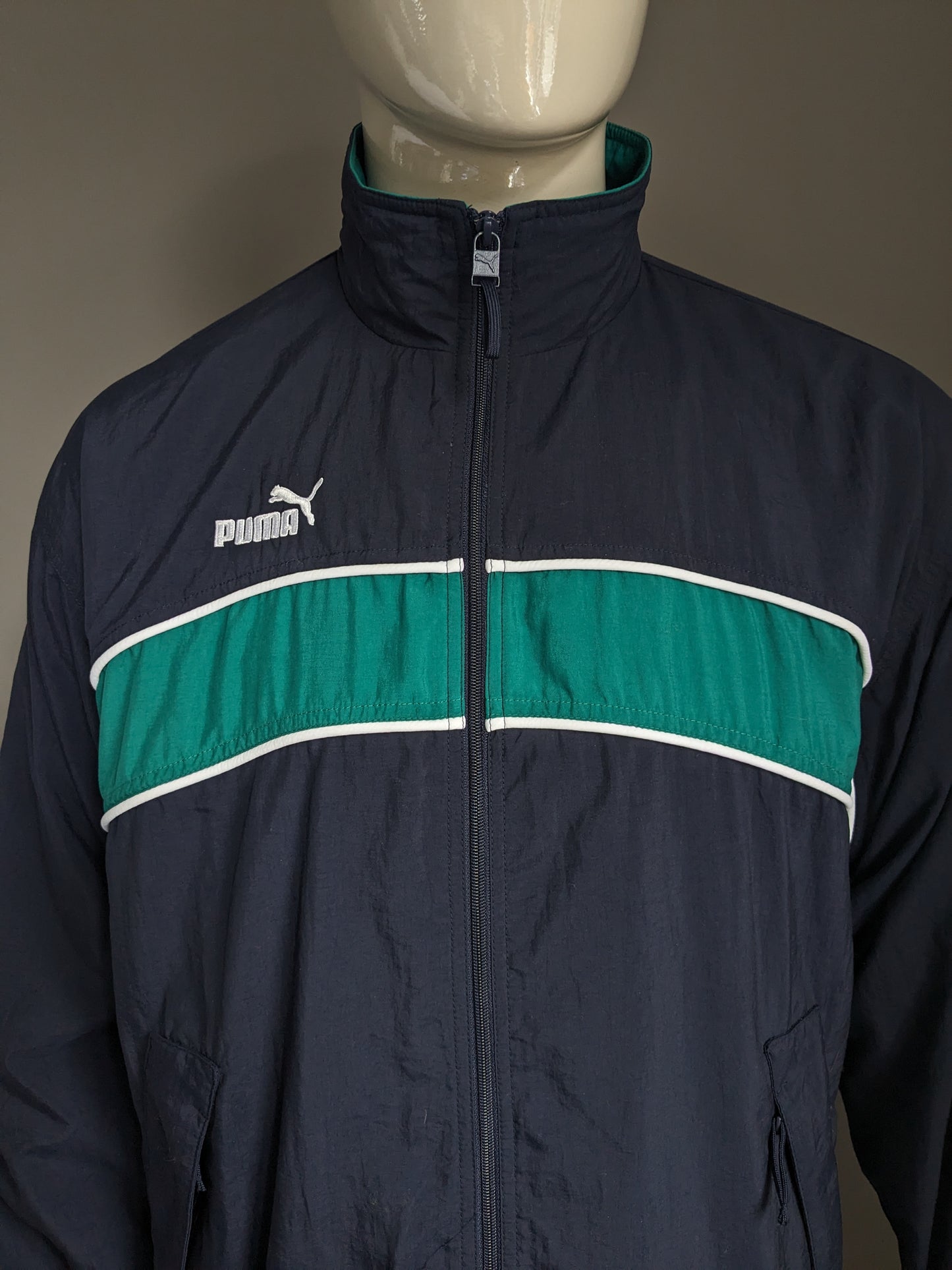 Vintage 80's-90's Puma sport jack. Donker Blauw Groen Wit gekleurd. Maat XL.