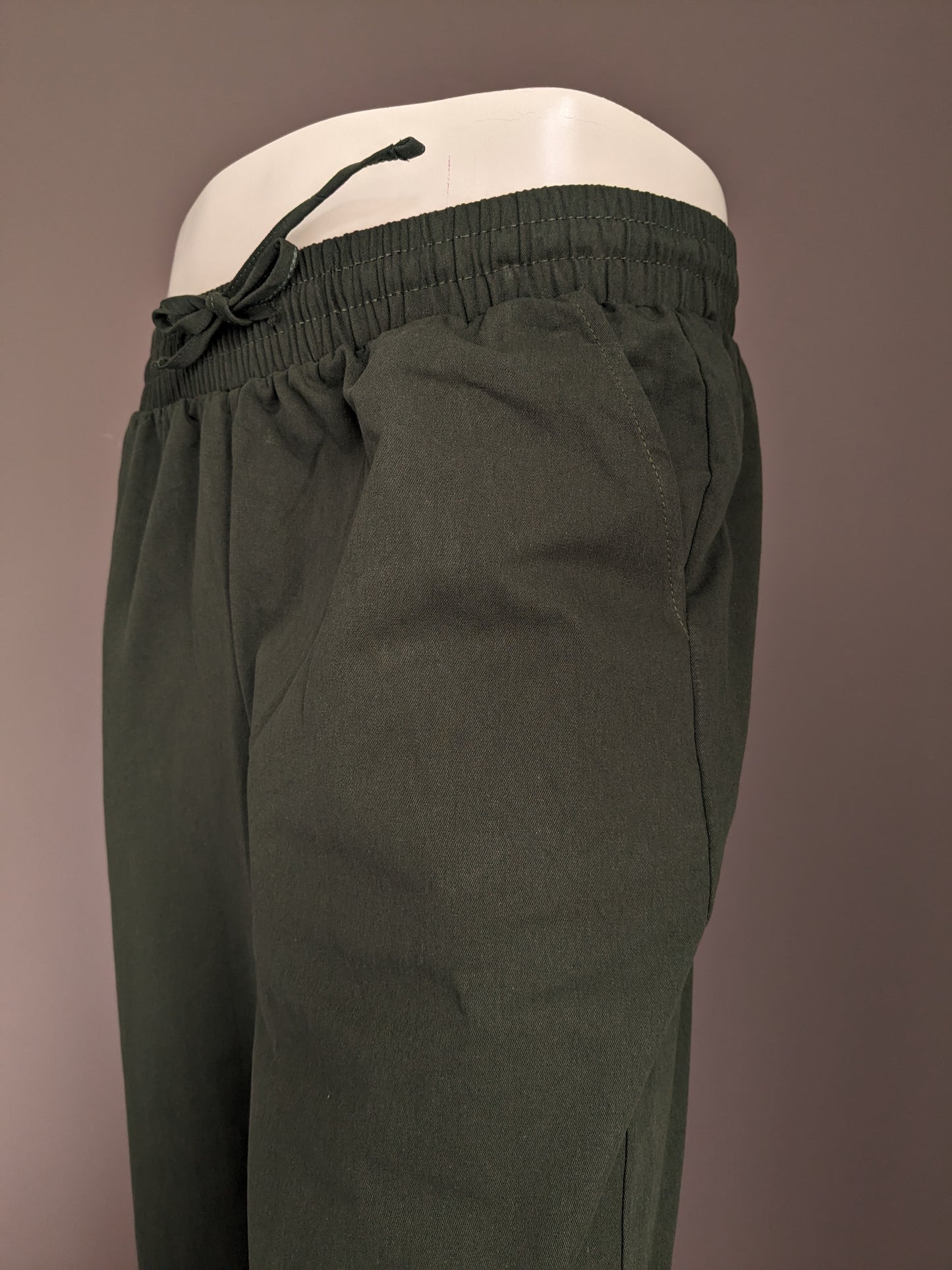 Merkloos Casual broek met elastische band. Groen gekleurd. Maat M
