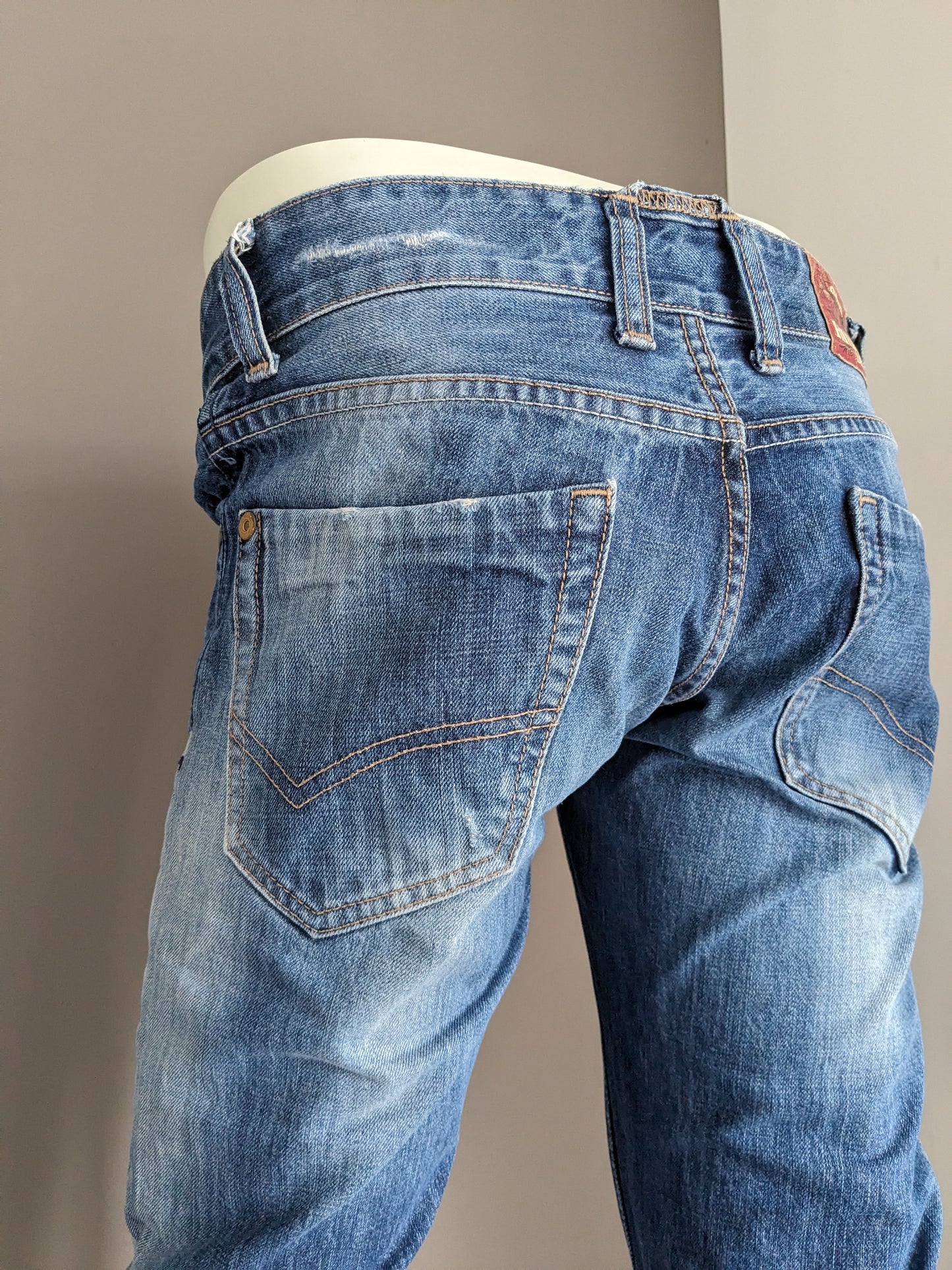 Tommy Hilfiger jeans. Blauw gekleurd. Maat W29 - L32. type Rogar. Regular Fit.