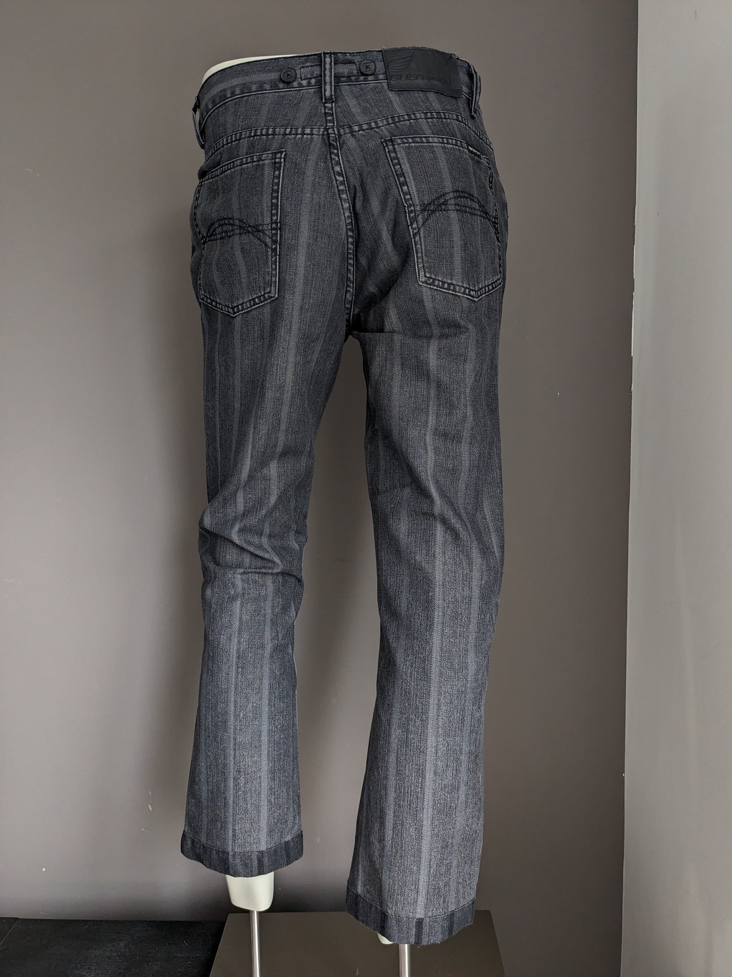 Jeans de edición de culto con aplicaciones de tirantes. Rayas negras grises. Tamaño W32 - L28.