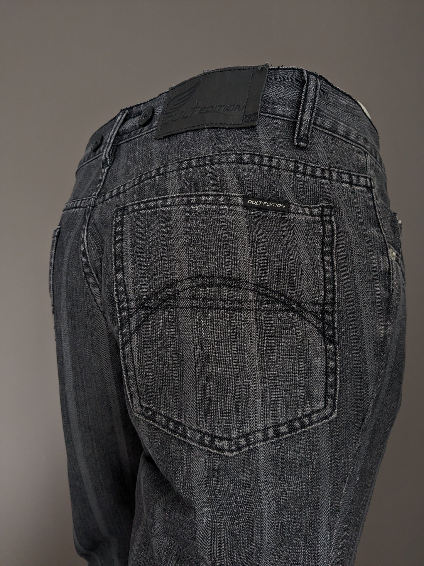 Jeans à édition culte avec applications de bretelles. Black gris rayé. Taille W32 - L28.