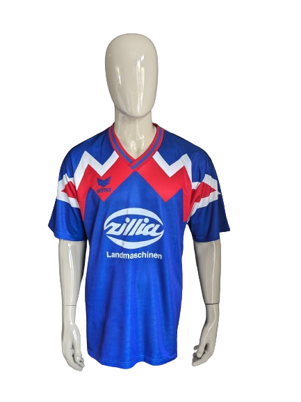 Vintage Erima sport shirt met V-Hals. Rood Blauw Wit gekleurd. Maat XL.