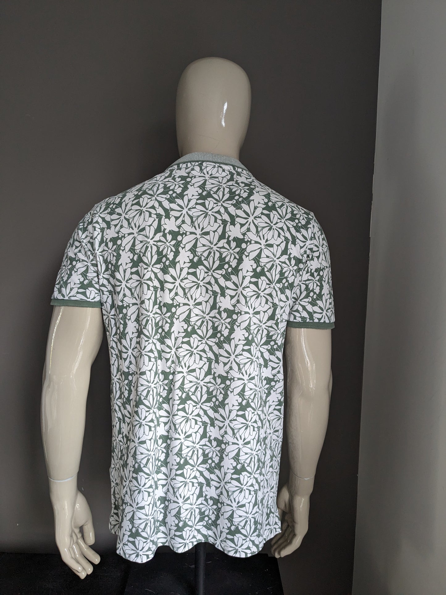 Blue Industry Polo. Green white flowers print. Size XL.