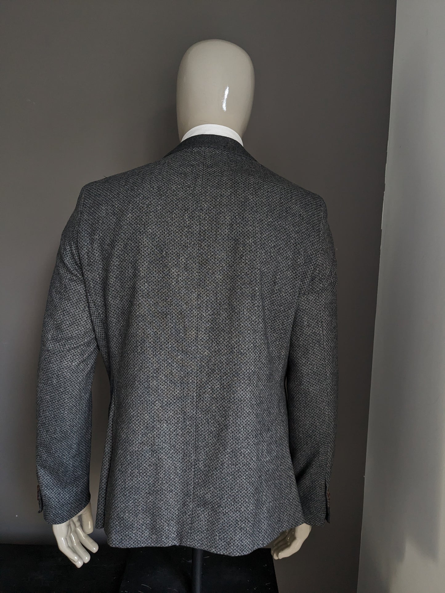 Desencadenantes y chaqueta de lana a medida. Motivo gris. Tamaño 54 / L. 50% de lana.