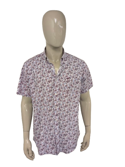 Chemise à manches courtes Meyer & Meyer. De couleur bleu rouge. Taille 2XL/XXL.