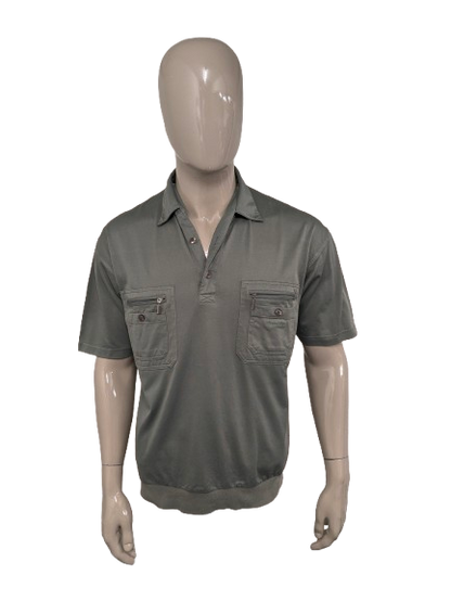 Roger Kent vintage polo met elastische band. Groen gekleurd. Maat L.
