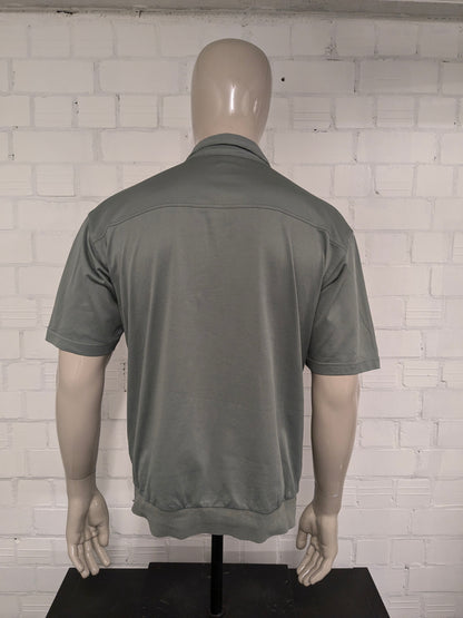 Roger Kent vintage polo met elastische band. Groen gekleurd. Maat L.