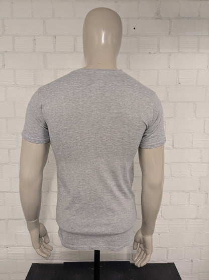 UBS World Series Champions Shirt. Gray with print. Size S.