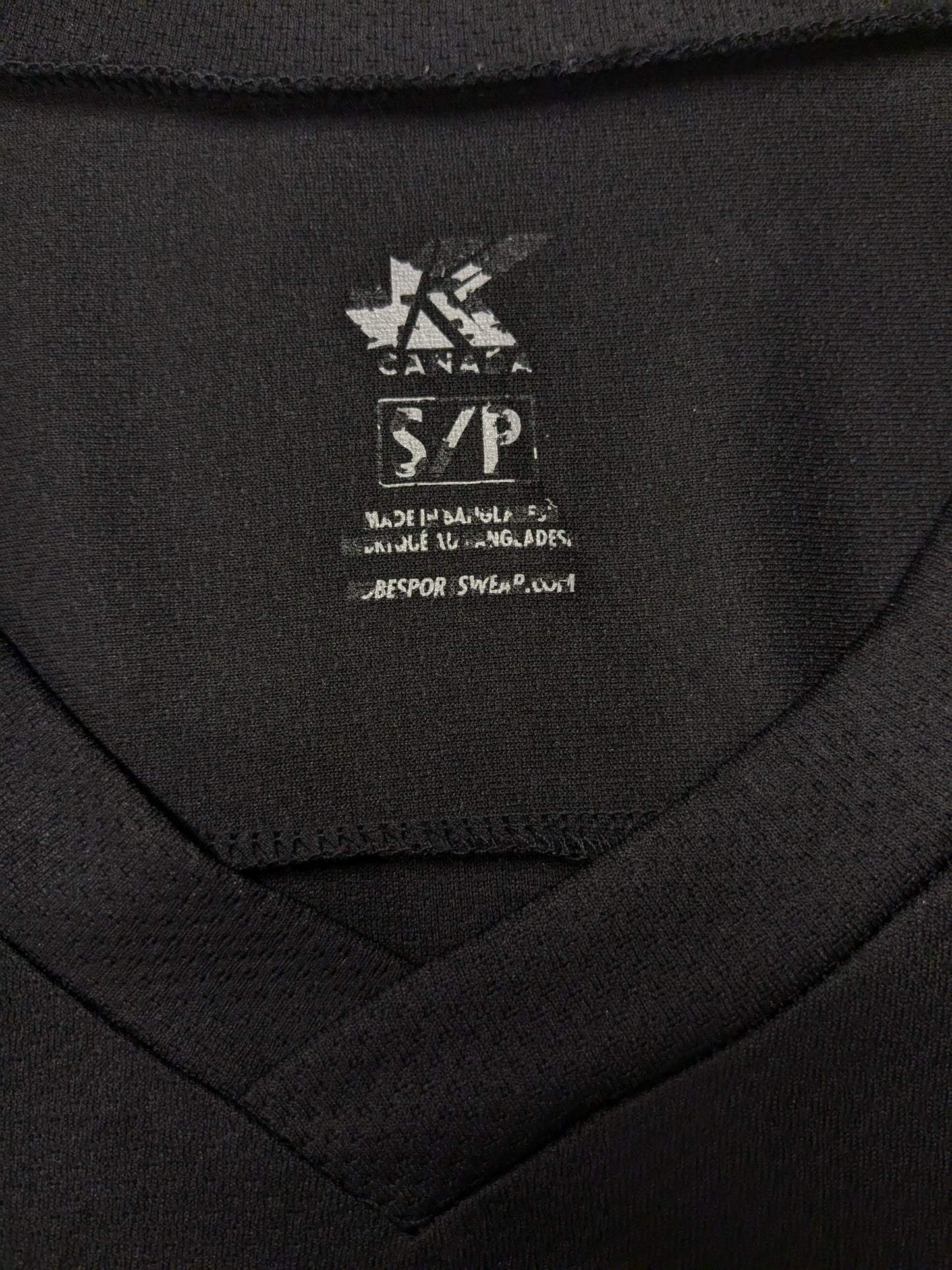 Oshawa Ringette sport longsleeve met V-Hals. Zwart met opdruk. Oversized S / M.