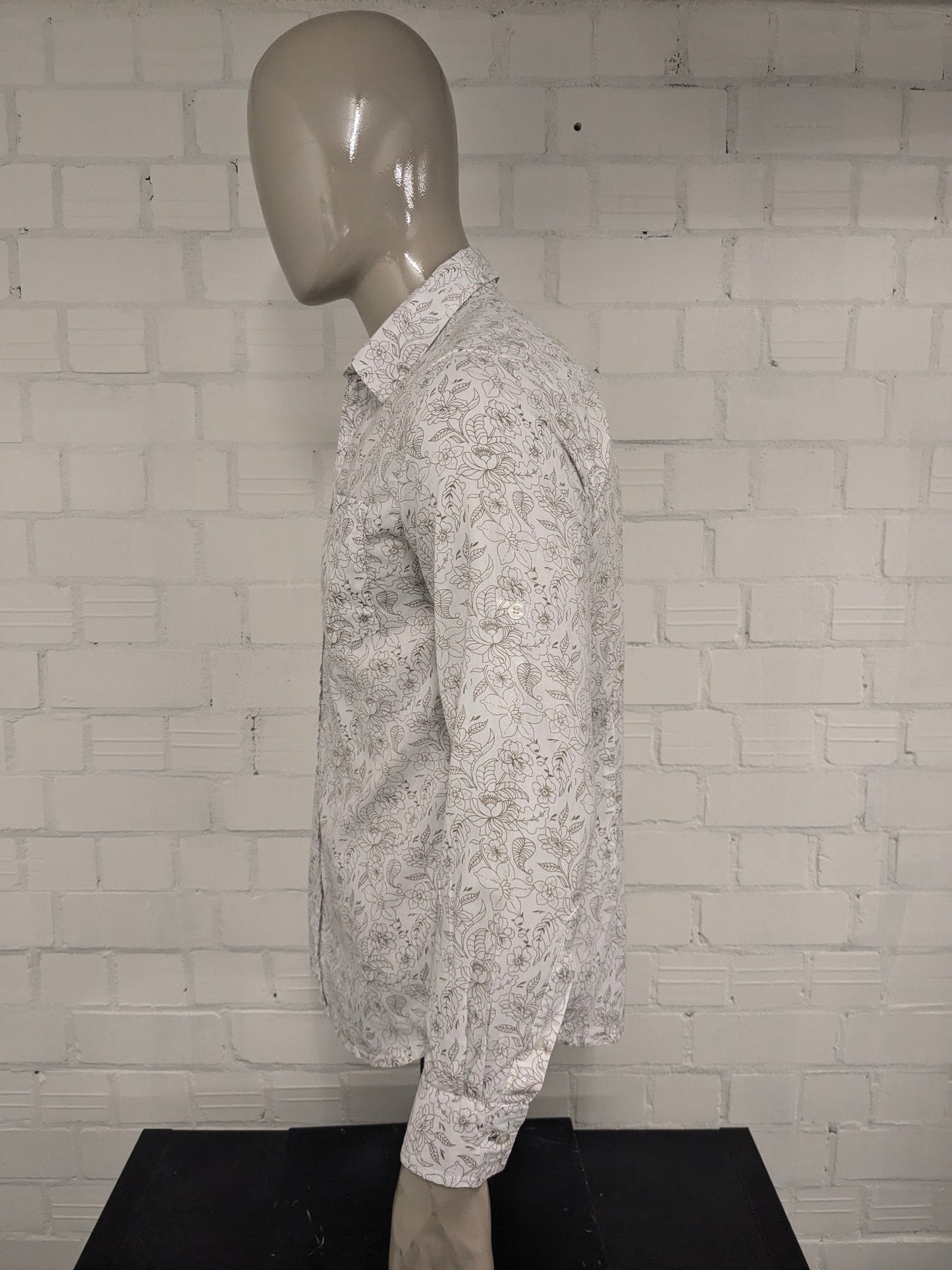 Simpugi di semplicità della maglietta beige marrone floreale. Taglia M.