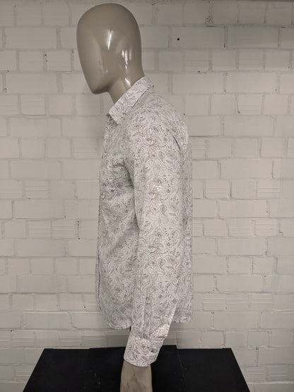 Simpugi di semplicità della maglietta beige marrone floreale. Taglia M.