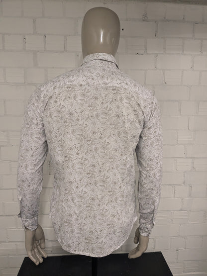 Simpugi di semplicità della maglietta beige marrone floreale. Taglia M.