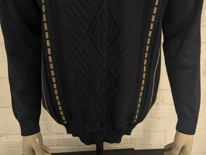 Suéter de lana de Luigi Luigi Luigi con cuello en V. Blue beige de color negro. Tamaño L. 50% de lana.