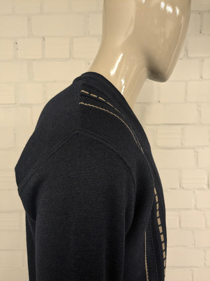 Suéter de lana de Luigi Luigi Luigi con cuello en V. Blue beige de color negro. Tamaño L. 50% de lana.