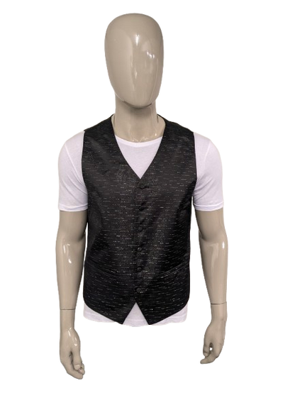 Black n white waistcoat. Black silver -colored shiny motif. Size L.