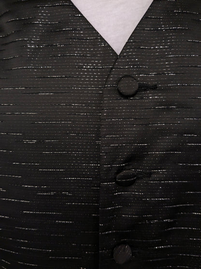 Black n white waistcoat. Black silver -colored shiny motif. Size L.