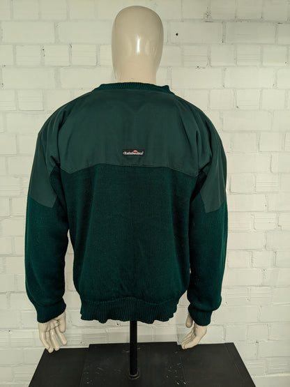 Pull de pluie vintage Eau et pull de golf à travers le vent. Vert coloré. Taille xl.