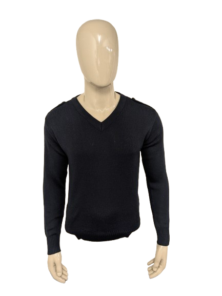 Pull en laine avec col en V. Bleu foncé avec applications d'épaule. Taille L. 60% de laine.