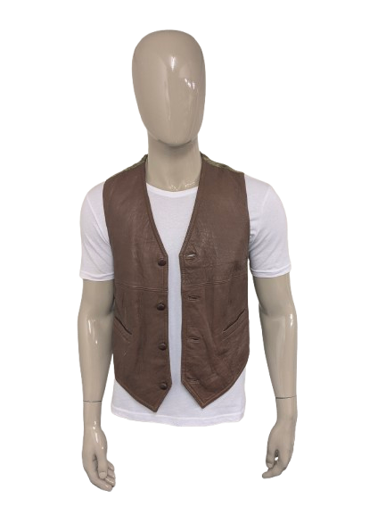 Giuta di cuoio vintage. Colorato marrone. Taglia M.